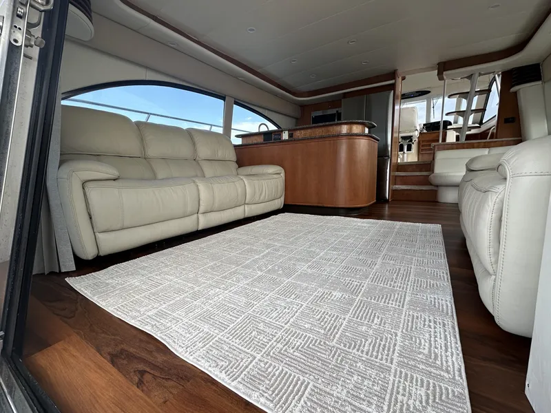 Slide: The Image of Luxurious interior of 2004 Meridian 580 Pilothouse yacht with leather seating and elegant wood finishes. - 27