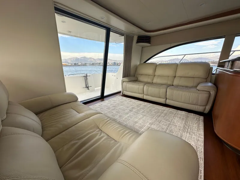 Slide: The Image of Luxurious interior of 2004 Meridian 580 Pilothouse yacht with leather seating and ocean view. - 30