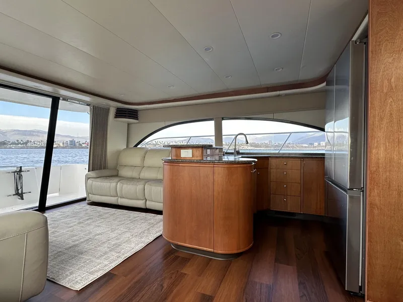 Slide: The Image of Luxurious interior of 2004 Meridian 580 Pilothouse yacht with modern kitchen and seating area. - 31