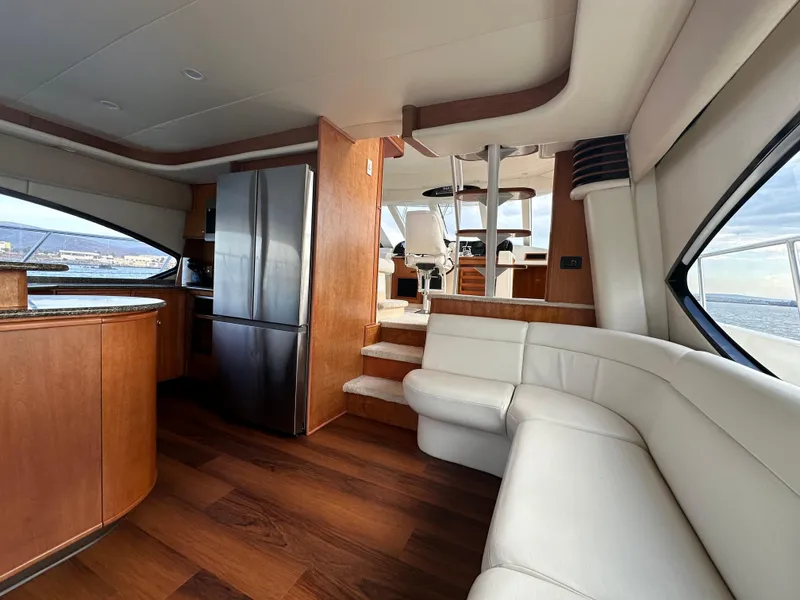 Slide: The Image of Luxurious interior of 2004 Meridian 580 Pilothouse yacht with modern kitchen and seating. - 37