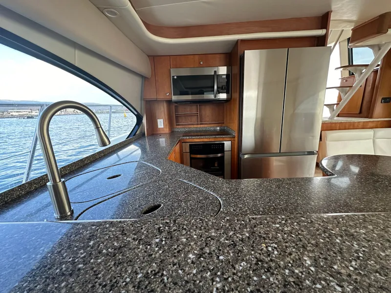 Slide: The Image of Luxurious kitchen interior of 2004 Meridian 580 Pilothouse yacht with modern appliances. - 41