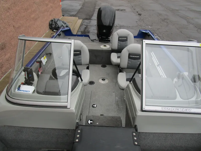 Slide: The Image of 2017 Tracker Pro Guide 175 WT boat interior with seating and windshield. - 7