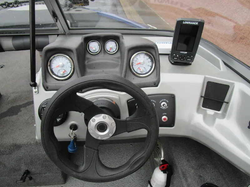Slide: The Image of 2017 Tracker Pro Guide 175 WT boat dashboard with steering wheel and Lowrance fish finder. - 8