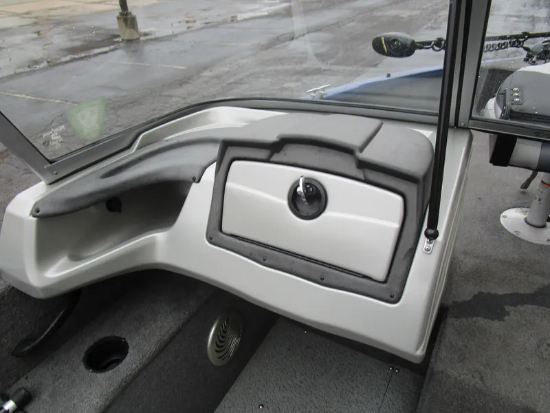 Slide: The Image of 2017 Tracker Pro Guide 175 WT boat interior with storage compartment and dashboard. - 9