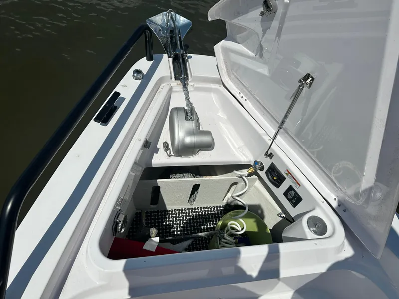 Slide: The Image of 2022 Axopar 37 XC Cross Cabin BRABUS LINE anchor compartment with open hatch. - 16