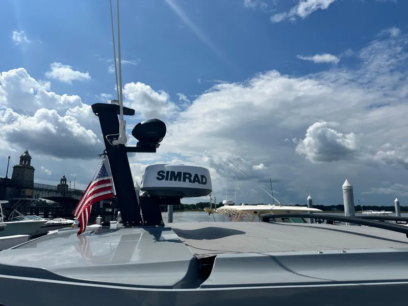 Slide: The Image of 2022 Axopar 37 XC Cross Cabin BRABUS LINE with Simrad equipment and American flag. - 24