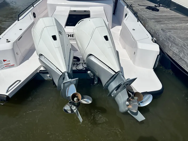 Slide: The Image of Twin outboard engines on a 2022 Axopar 37 XC Cross Cabin BRABUS LINE boat. - 25