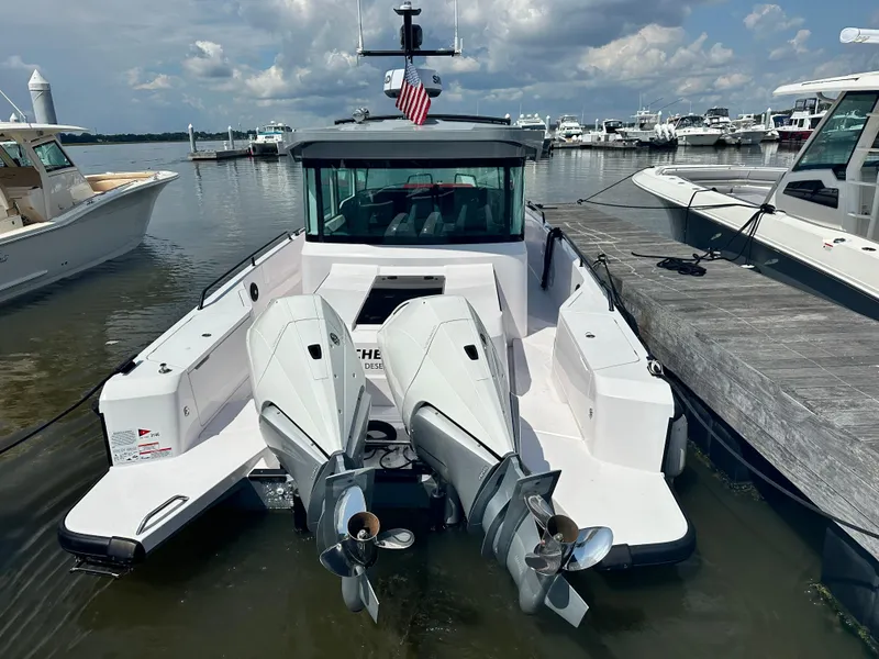 Slide: The Image of Axopar 37 XC Cross Cabin BRABUS LINE 2022 docked with dual outboard engines. - 26