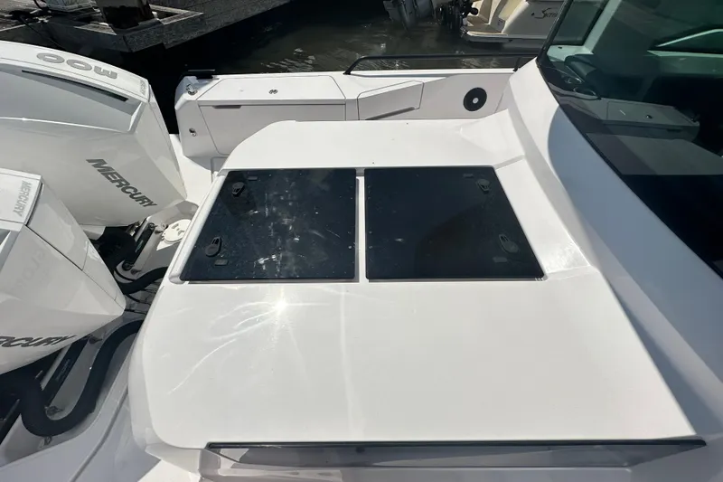 Slide: The Image of 2022 Axopar 37 XC CROSS CABIN boat with Mercury engines, docked in sunlight. - 3