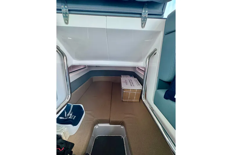 Slide: The Image of Interior cabin of 2022 Axopar 37 XC CROSS CABIN with seating and storage. - 37