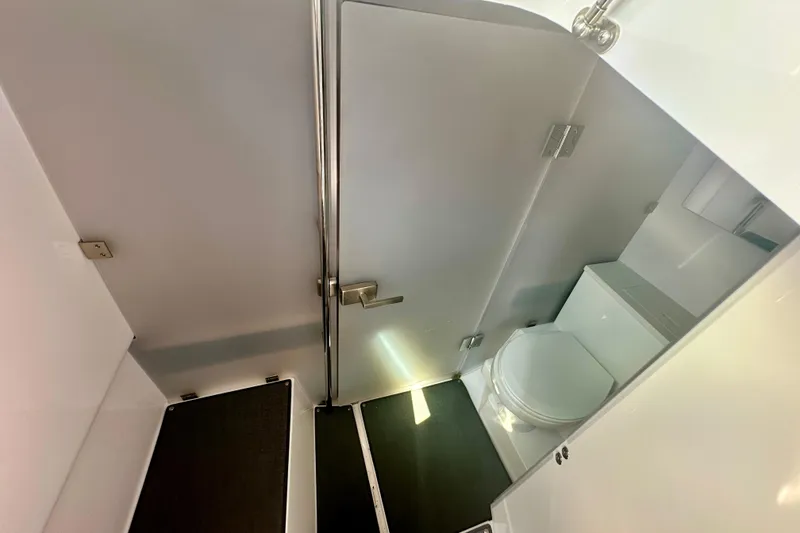 Slide: The Image of 2022 Axopar 37 XC CROSS CABIN bathroom interior with modern fixtures and compact design. - 40