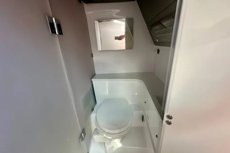 Slide: The Image of 2022 Axopar 37 XC CROSS CABIN bathroom with modern fixtures and compact design. - 41