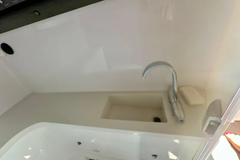 Slide: The Image of Compact sink area in 2022 Axopar 37 XC CROSS CABIN boat. - 43