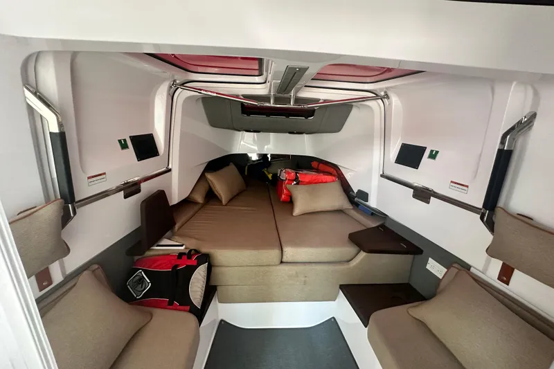 Slide: The Image of 2022 Axopar 37 XC CROSS CABIN interior with cozy seating and modern design. - 45