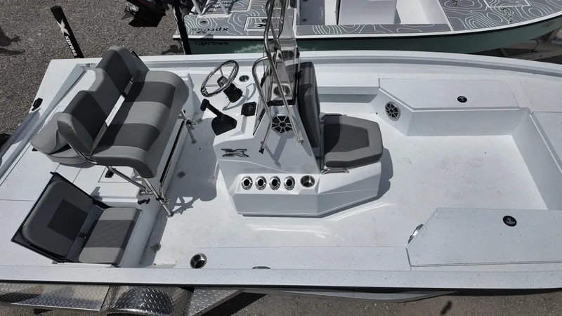Slide: The Image of 2025 Xpress H22B boat interior with seating and console, top view. - 19