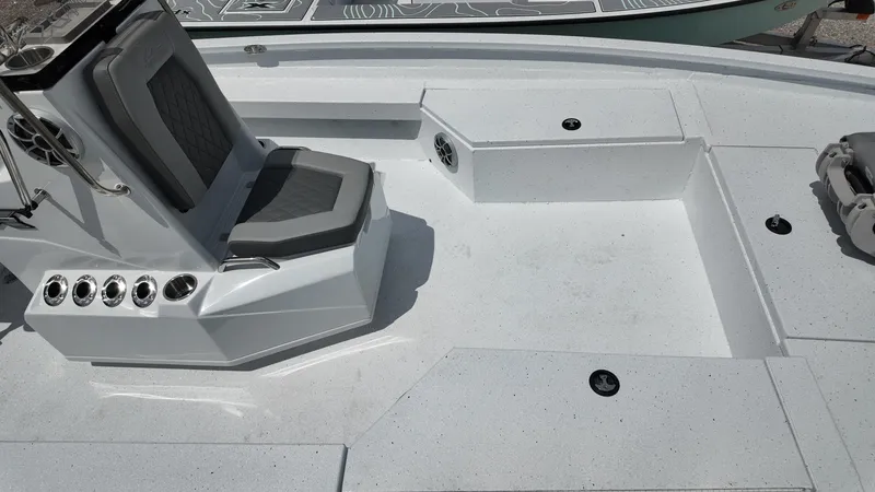 Slide: The Image of 2025 Xpress H22B boat deck with seating and rod holders. - 20
