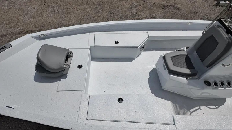 Slide: The Image of 2025 Xpress H22B boat deck with seating and storage compartments. - 25