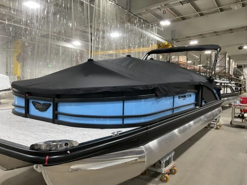 Slide: The Image of 2025 Bennington R Bowrider Swingback 24 RTSB pontoon boat in storage, covered and secured. - 16