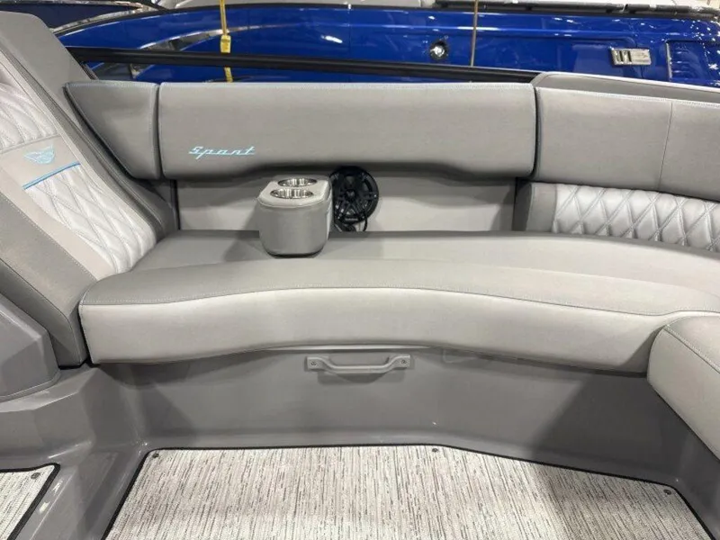 Slide: The Image of 2025 Bennington R Bowrider Swingback 24 RTSB interior with gray seating and cup holder. - 21