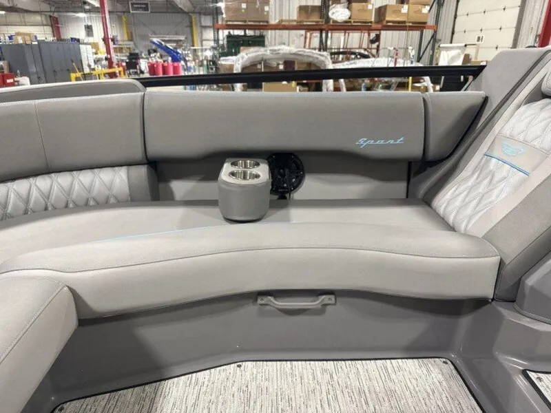 Slide: The Image of 2025 Bennington R Bowrider Swingback 24 RTSB interior with gray seating and cup holder. - 22