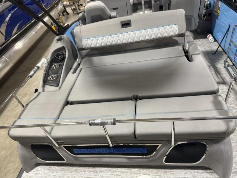 Slide: The Image of 2025 Bennington R Bowrider Swingback 24 RTSB with luxurious gray seating and cup holders. - 23