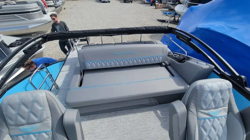 Slide: The Image of 2025 Bennington R Bowrider Swingback 24 RTSB with luxurious seating and modern design. - 29