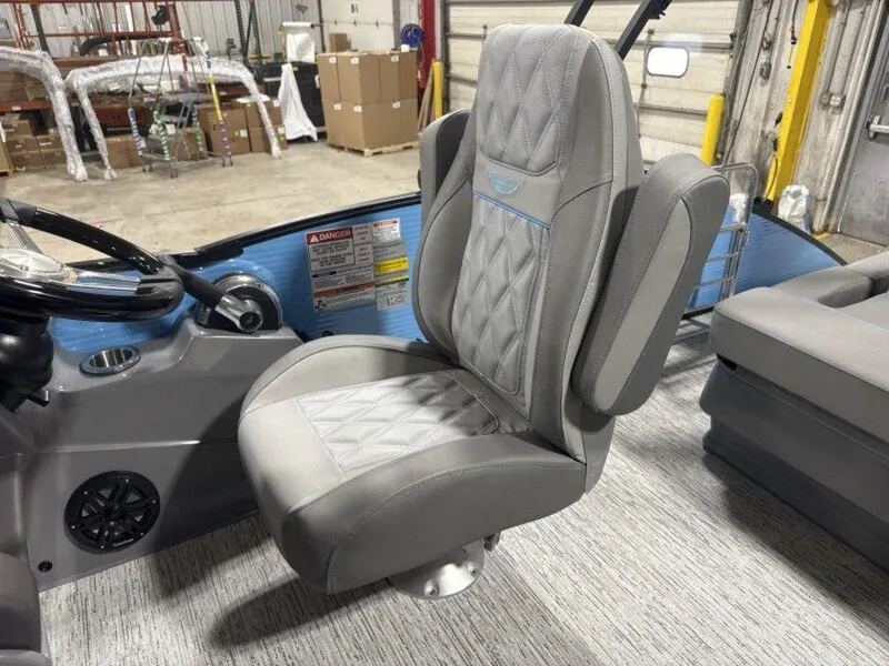 Slide: The Image of Captain's chair in 2025 Bennington R Bowrider Swingback 24 RTSB boat, featuring gray upholstery. - 9