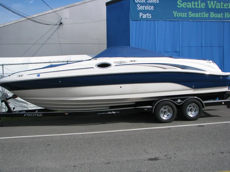 Slide: The Image of 2003 Sea Ray 240 Sundeck boat on trailer, parked outside Seattle Water Sports. - 1