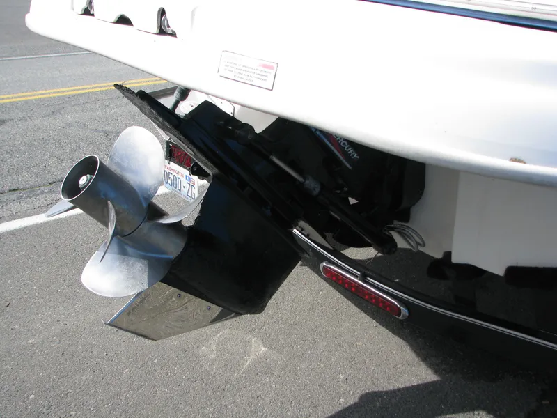 Slide: The Image of Propeller and stern of 2003 Sea Ray 240 Sundeck boat in parking lot. - 18