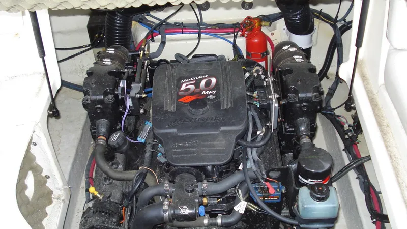 Slide: The Image of Engine compartment of a 2003 Sea Ray 240 Sundeck with MerCruiser 5.0 MPI engine. - 19