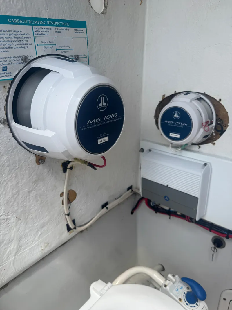 Slide: The Image of Marine equipment on a 1997 Stamas 290 Tarpon boat, featuring electronic components and wiring. - 21