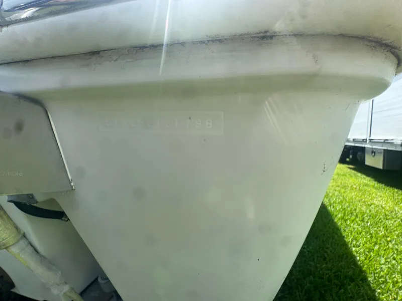 Slide: The Image of 1997 Stamas 290 Tarpon boat hull, close-up view in sunlight. - 37
