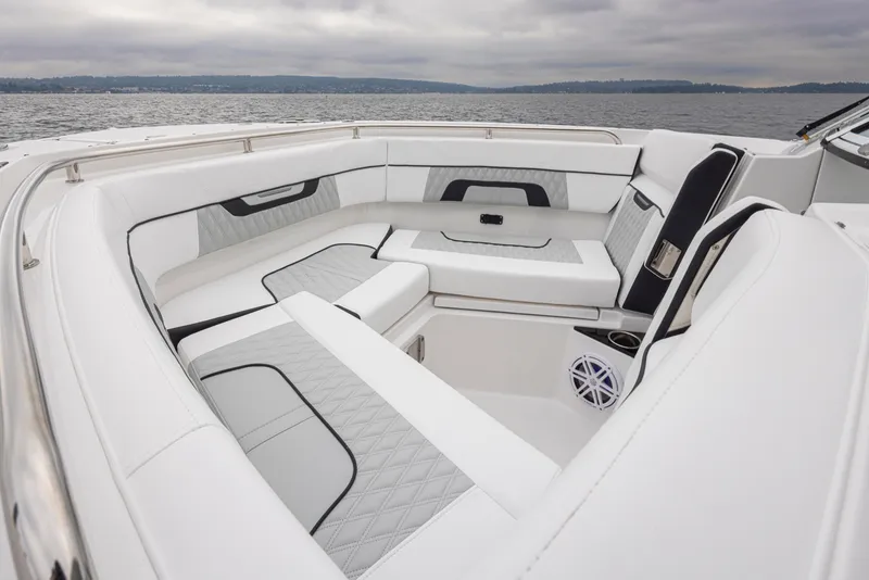 Slide: The Image of 2024 Blackfin 272 DC boat interior with luxurious white seating and ocean view. - 21
