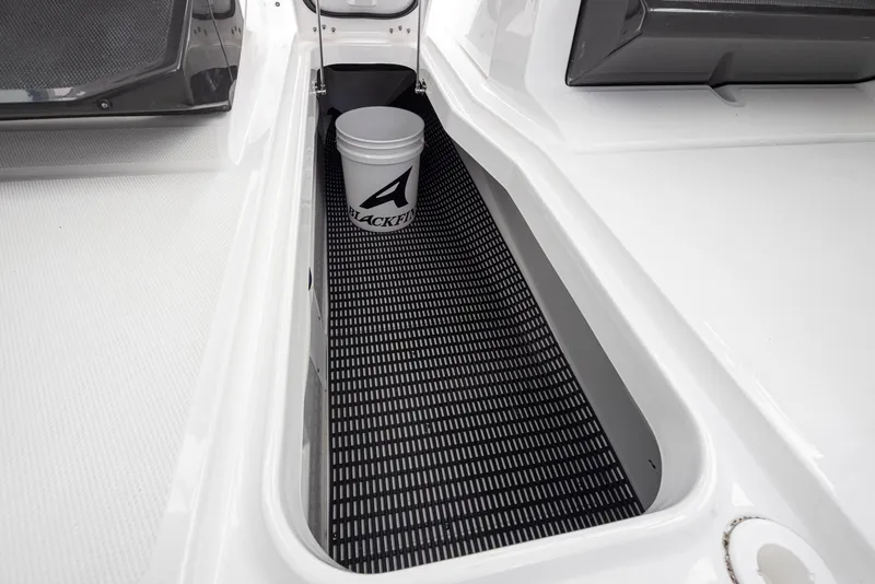 Slide: The Image of 2024 Blackfin 272 DC boat storage compartment with Blackfin bucket. - 32