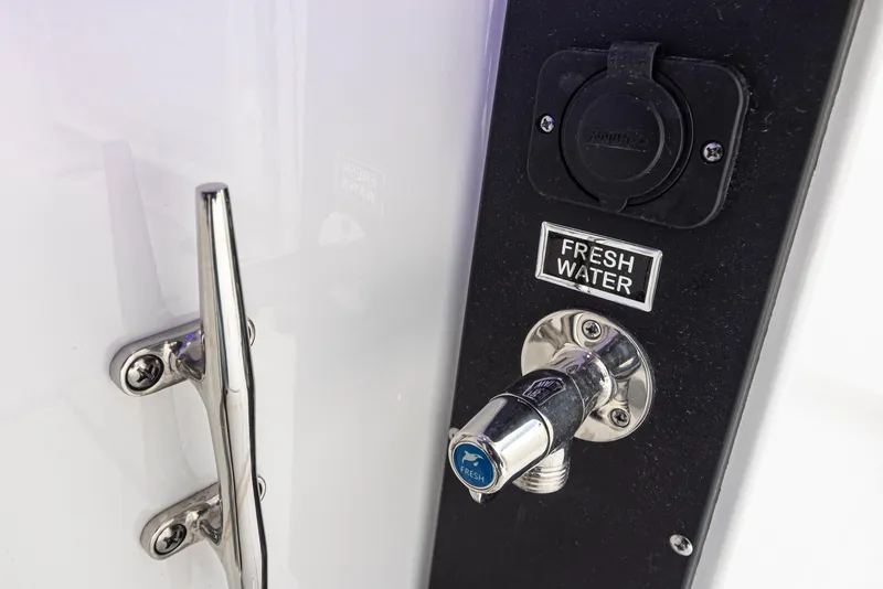 Slide: The Image of 2024 Blackfin 272 DC boat fresh water outlet and chrome handle detail. - 37