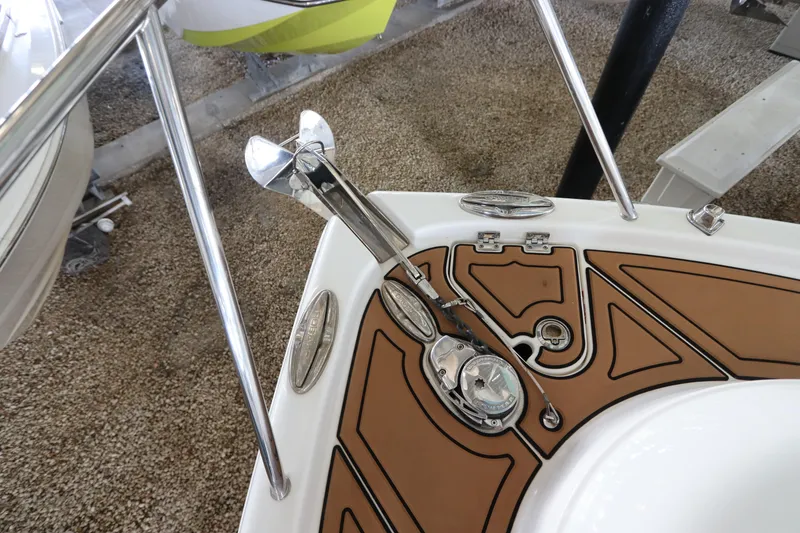 Slide: The Image of 2016 Robalo R265 Walkaround boat anchor and deck detail. - 19
