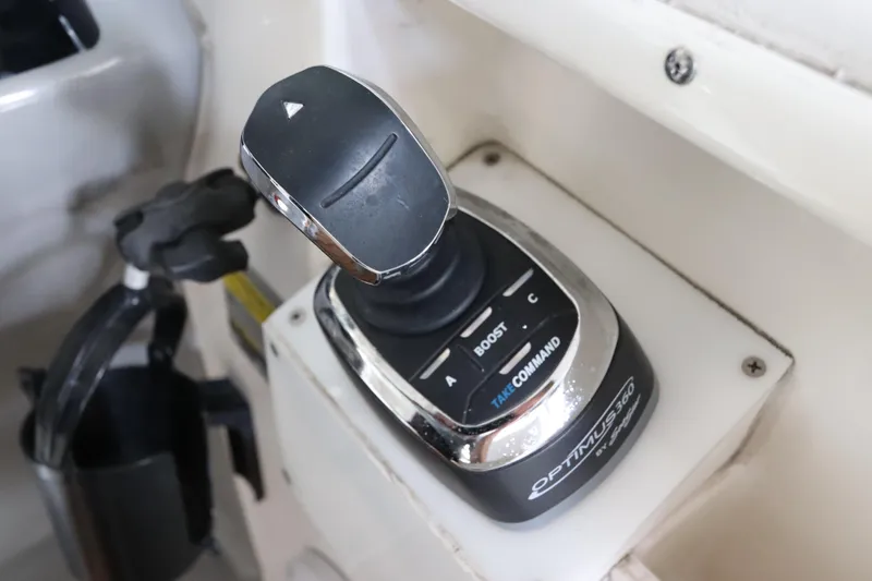 Slide: The Image of Joystick control on 2016 Robalo R265 Walkaround boat dashboard. - 31