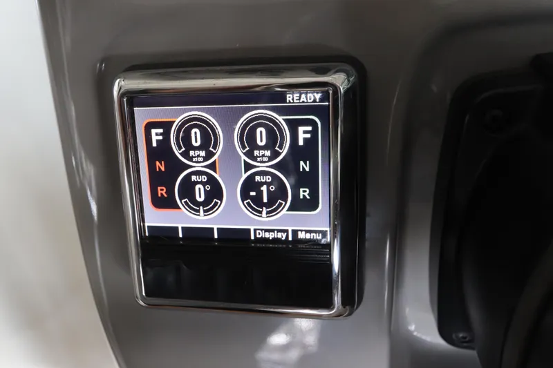 Slide: The Image of Digital control panel on 2016 Robalo R265 Walkaround boat, displaying RPM and rudder settings. - 32