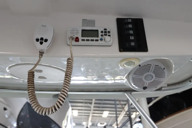 Slide: The Image of 2016 Robalo R265 Walkaround boat dashboard with radio and speaker system. - 36