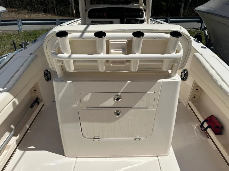 Slide: The Image of 2022 Grady-White 236 Fisherman boat interior with rod holders and storage compartments. - 12