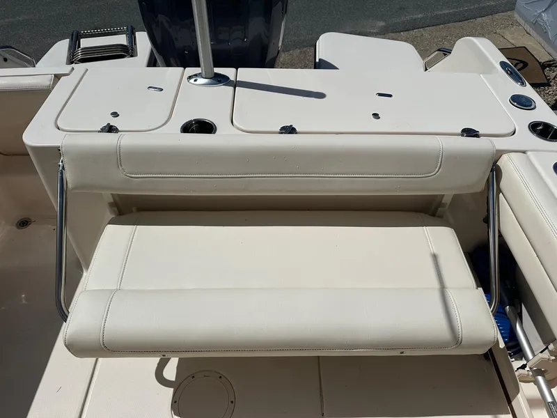 Slide: The Image of 2022 Grady-White 236 Fisherman boat seating area with white cushioned bench. - 14