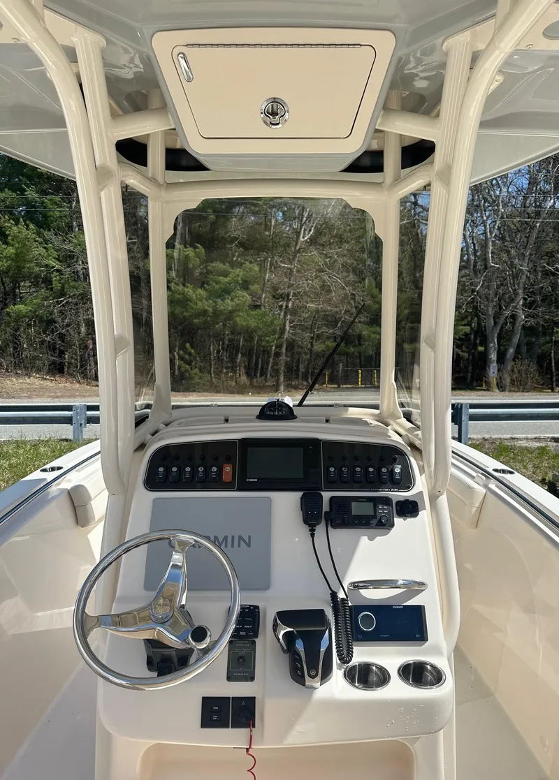 Slide: The Image of 2022 Grady-White 236 Fisherman boat console with steering wheel and navigation equipment. - 5