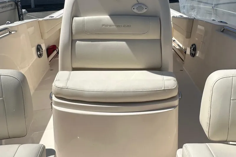 Slide: The Image of 2022 Grady-White 236 Fisherman boat interior with cushioned seating and storage. - 8