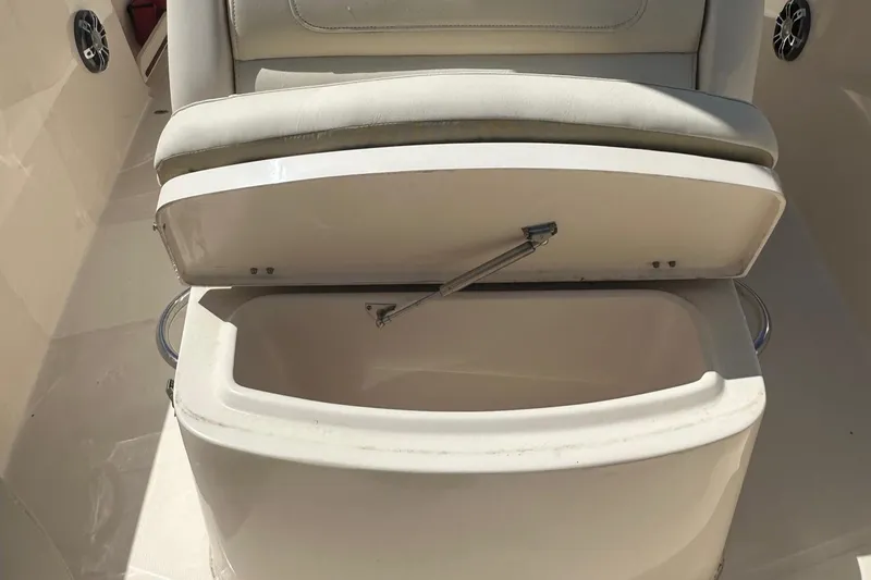 Slide: The Image of 2022 Grady-White 236 Fisherman boat seat with open storage compartment. - 9