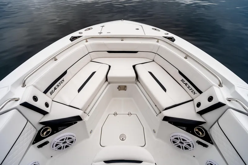 Slide: The Image of 2023 Blackfin 252 CC boat interior with white seating and sleek design. - 10