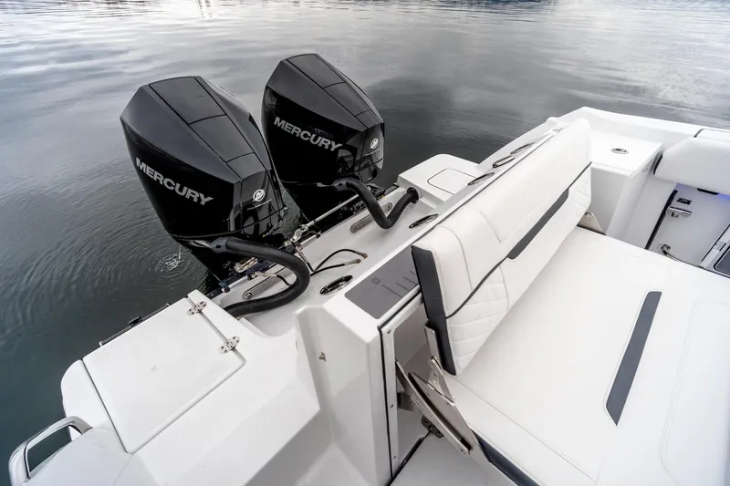Slide: The Image of 2023 Blackfin 252 CC boat with dual Mercury engines on calm water. - 22
