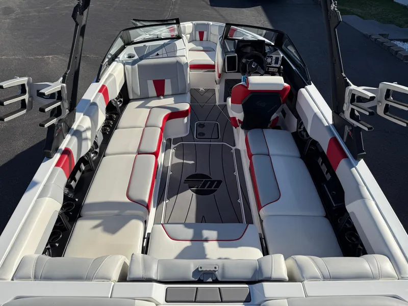 Slide: The Image of 2021 Malibu Wakesetter 23 LSV interior with white and red seating, sleek design. - 10