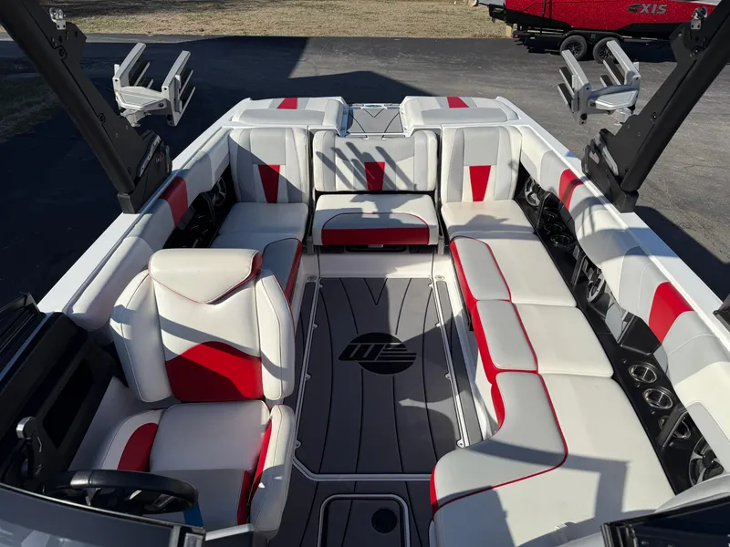 Slide: The Image of 2021 Malibu Wakesetter 23 LSV interior with red and white seating, open layout. - 11