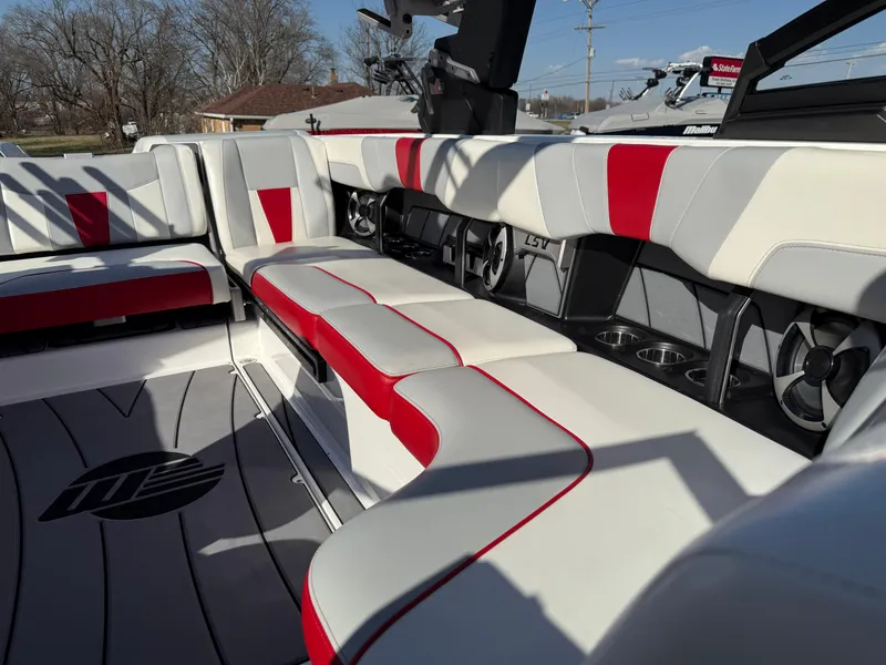 Slide: The Image of 2021 Malibu Wakesetter 23 LSV interior with red and white seating, sleek design. - 12
