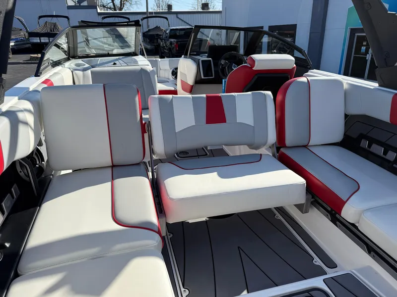 Slide: The Image of 2021 Malibu Wakesetter 23 LSV interior with white and red seating, modern design. - 19